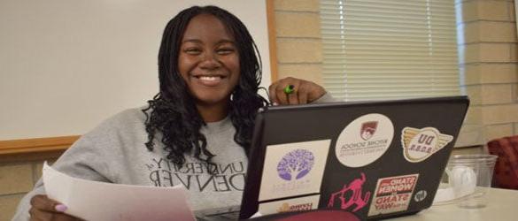 e-stem student at desk with laptop